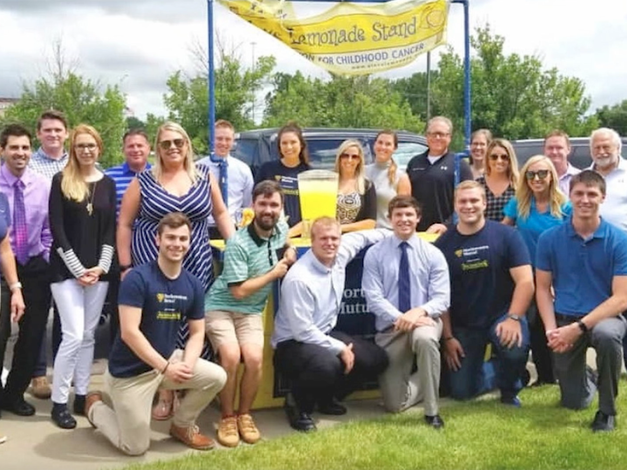 alex's lemonade stand with a group of employees