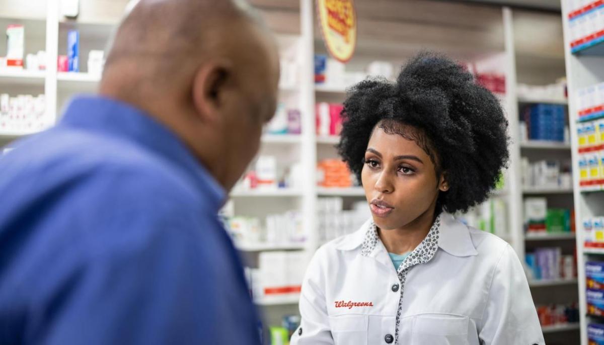 walgreens pharmacists talking to a customer