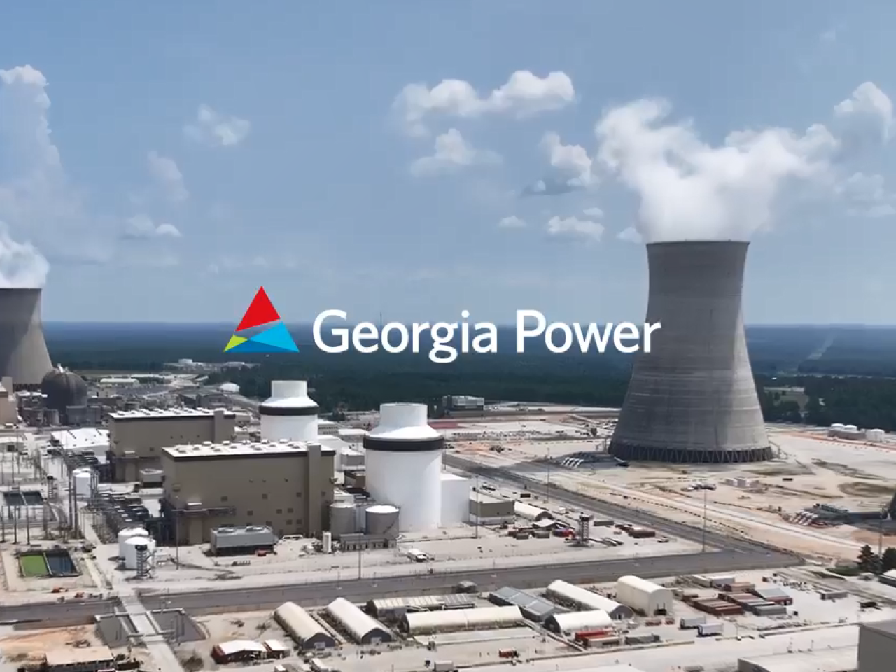 "Georgia Power" over an aerial view of a nuclear power plant.