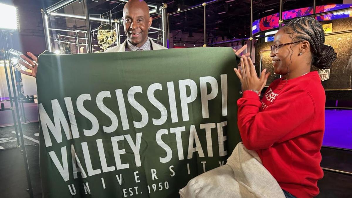 Two people holding a Mississippi Valley State University banner