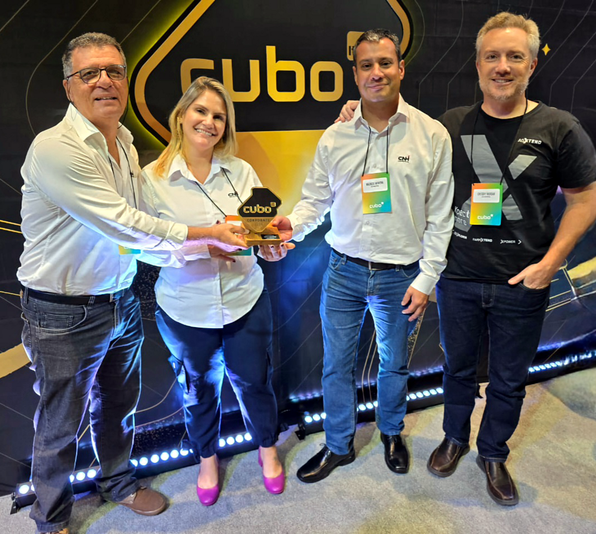 Four people holding the Golden Cube award