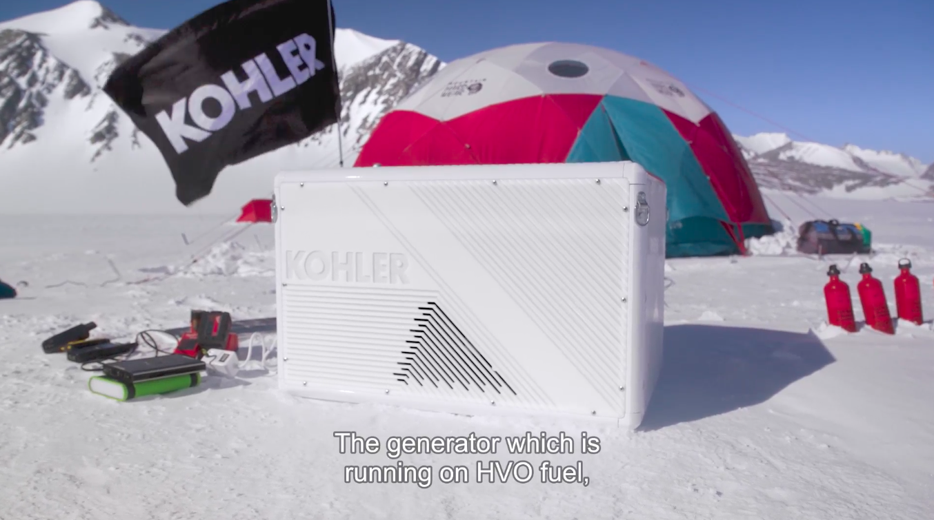 Kohler generator in front of tent and Kohler flag in Antarctica