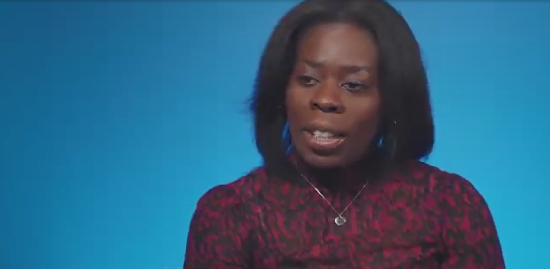 Baaba Jackson-Kuofie, a blue screen behind them.