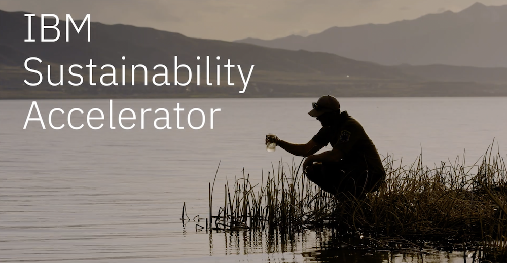 person collecting water from lake
