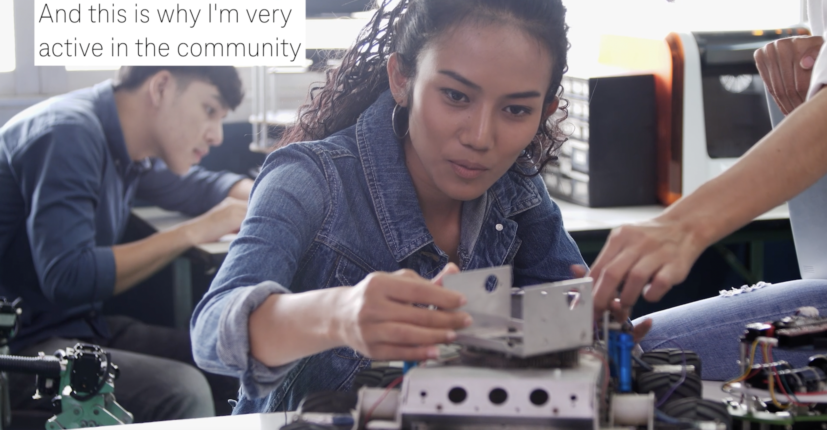 young woman working on building a device