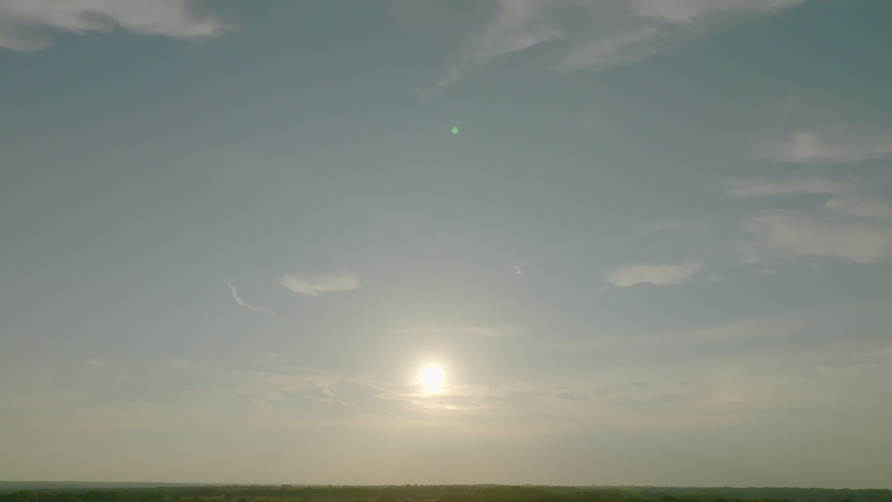 Sun rising over a flat landscape
