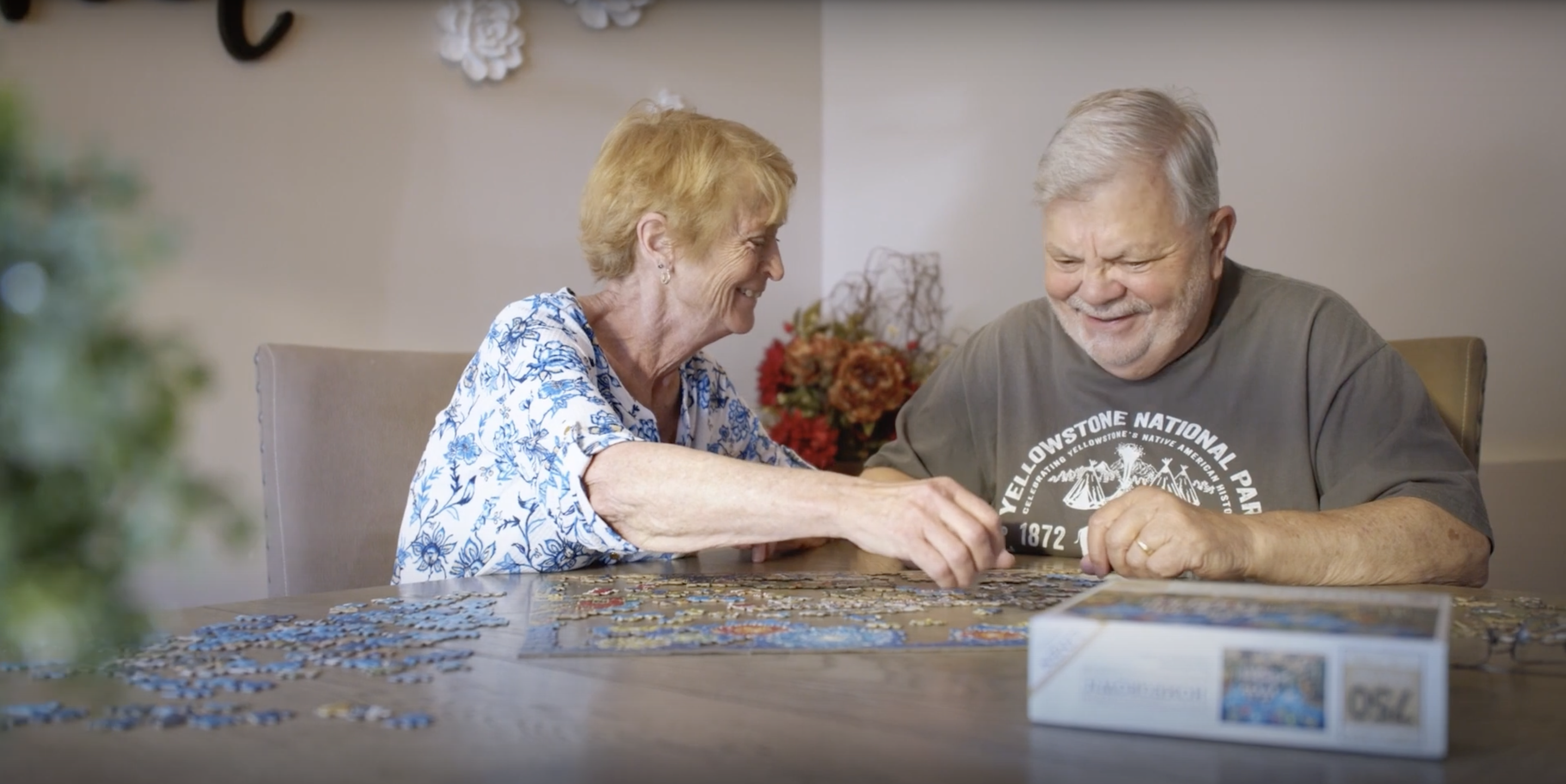 Marion and her husband working on a jigsaw puzzle together