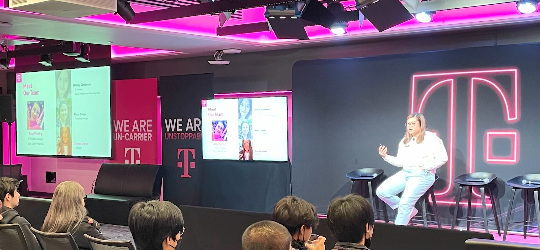 Amy Viettry speaking to a room of others.