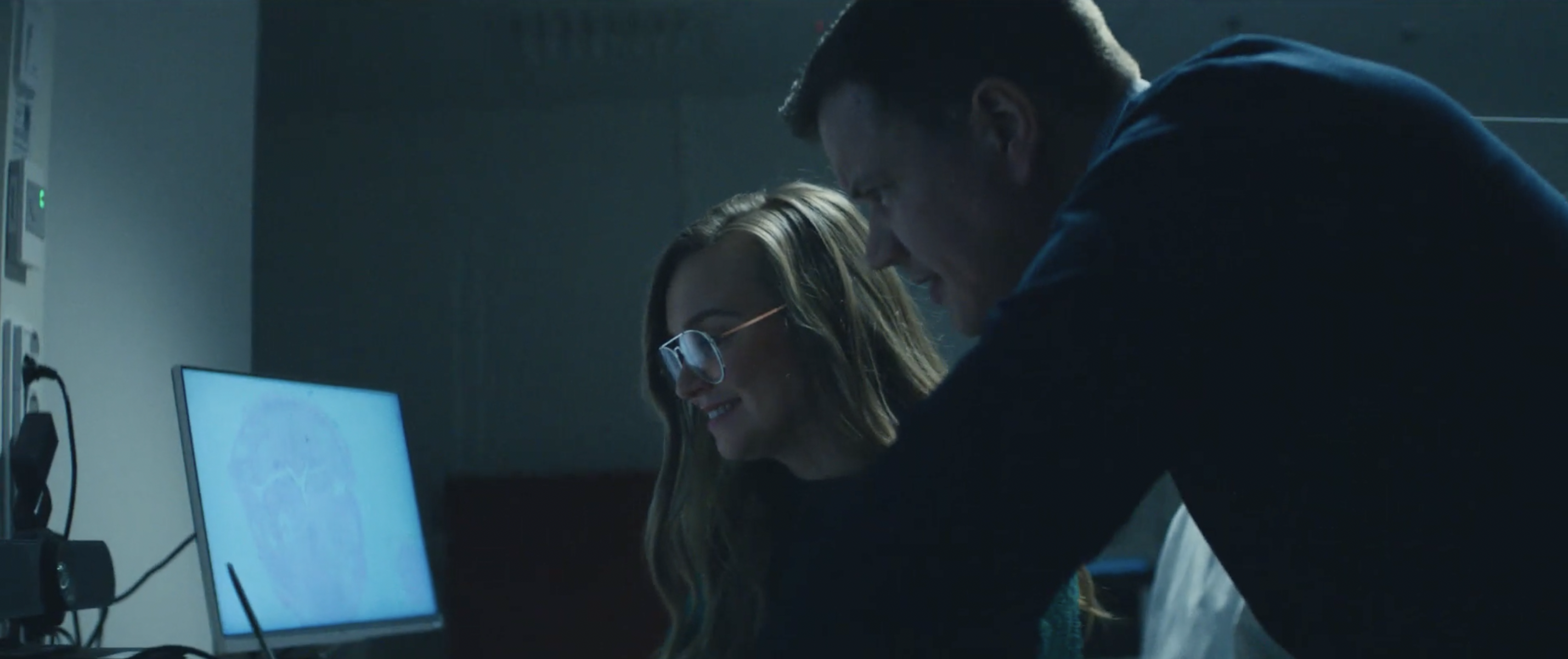 Two people working on computer together