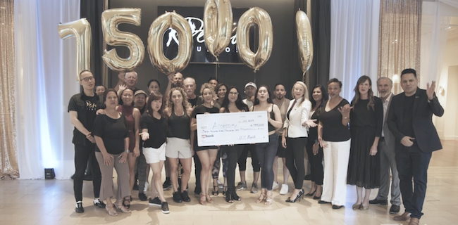 Deseo Studios receiving a $750,000 grant check from U.S. Bank.