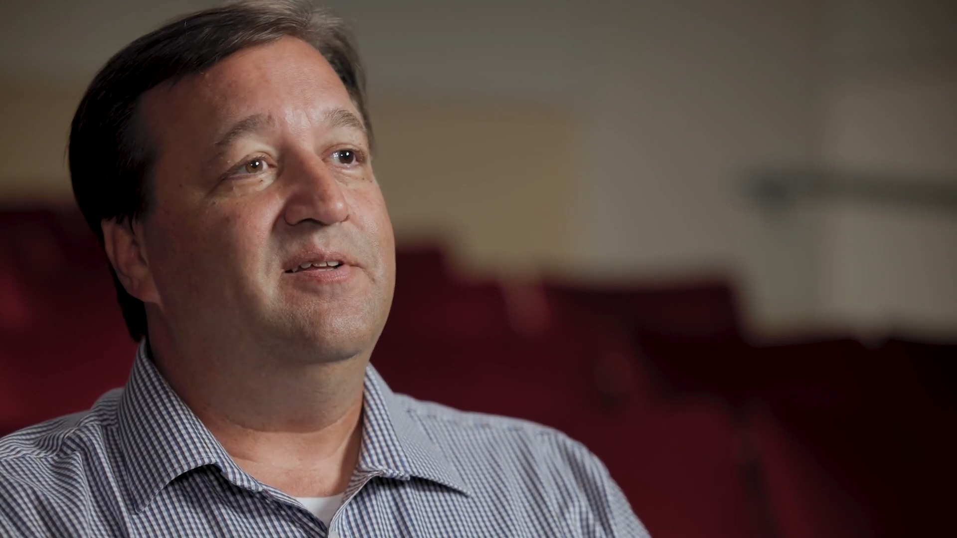 Tom Raymond sat on a chair in an interview