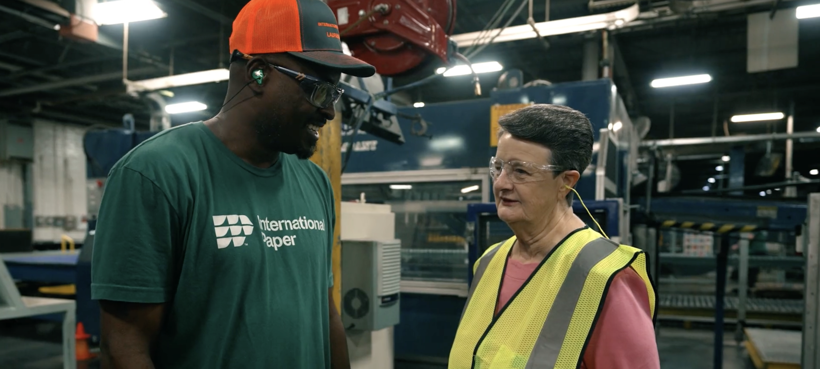 people talking in a factory