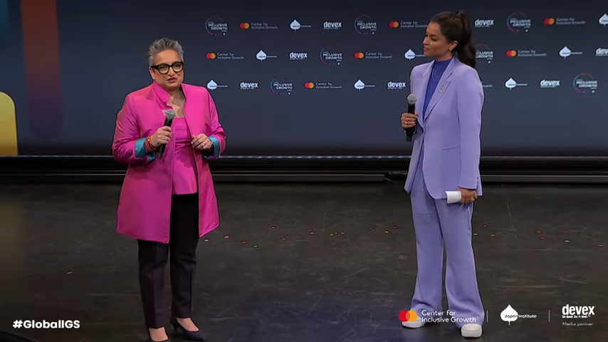 Two people talking on stage 