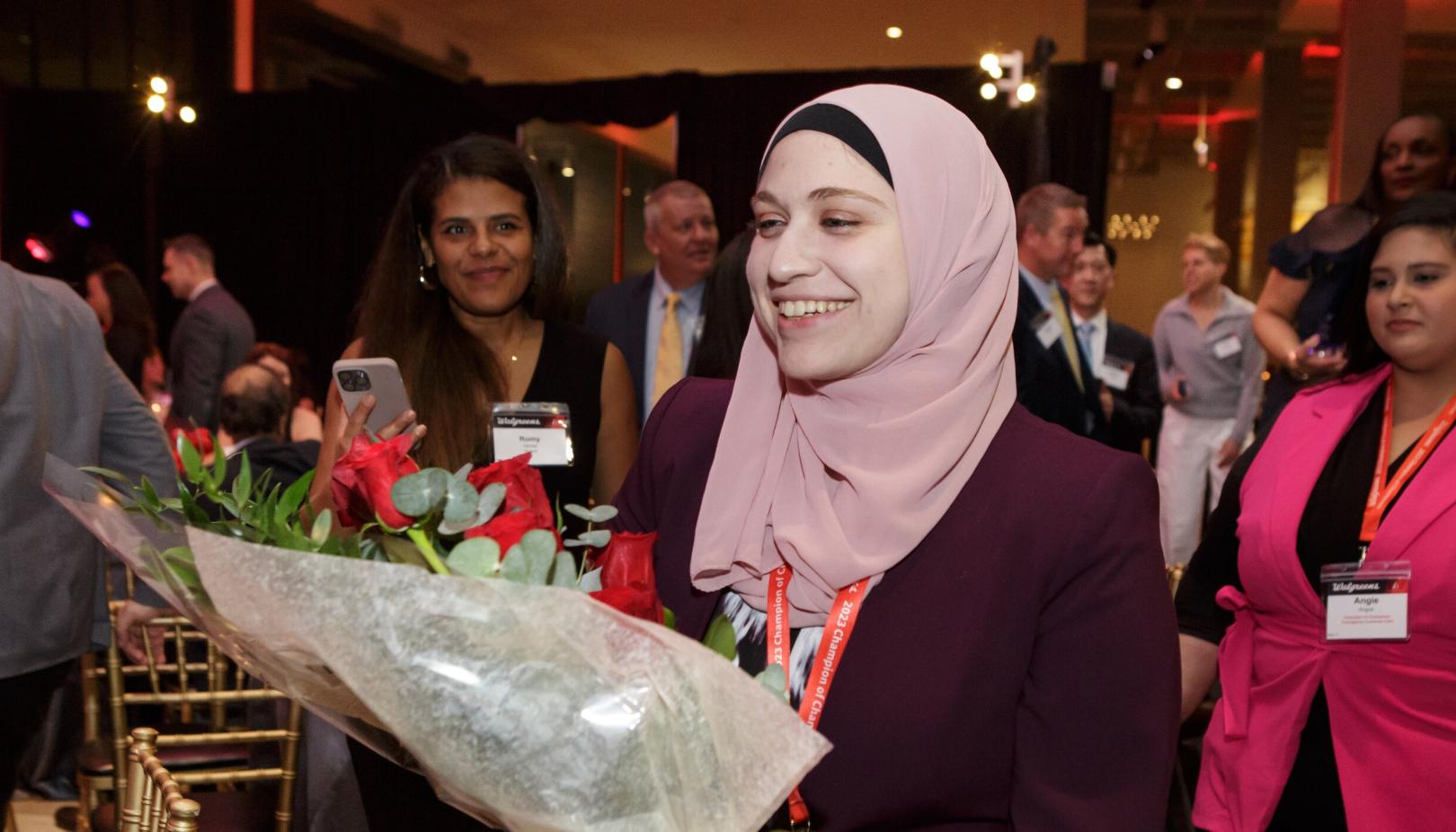 Ahlam Antar holding flowers