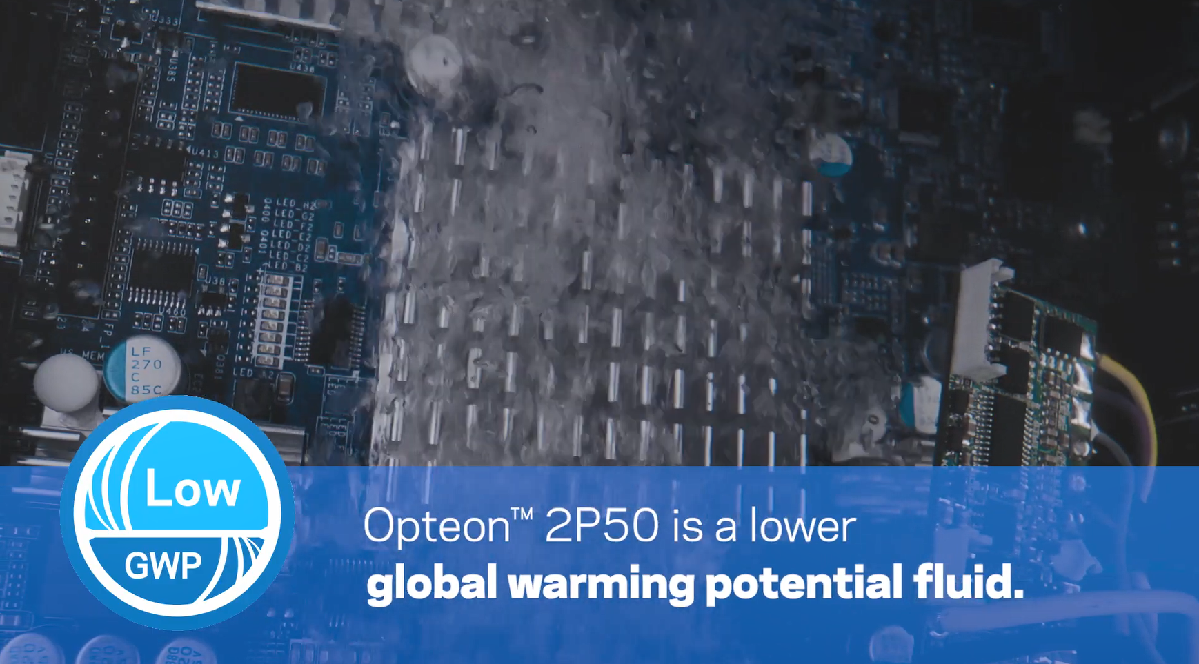 A computer part in a bubbling liquid. "Opteon 2P50 is a lower global warming potential fluid."