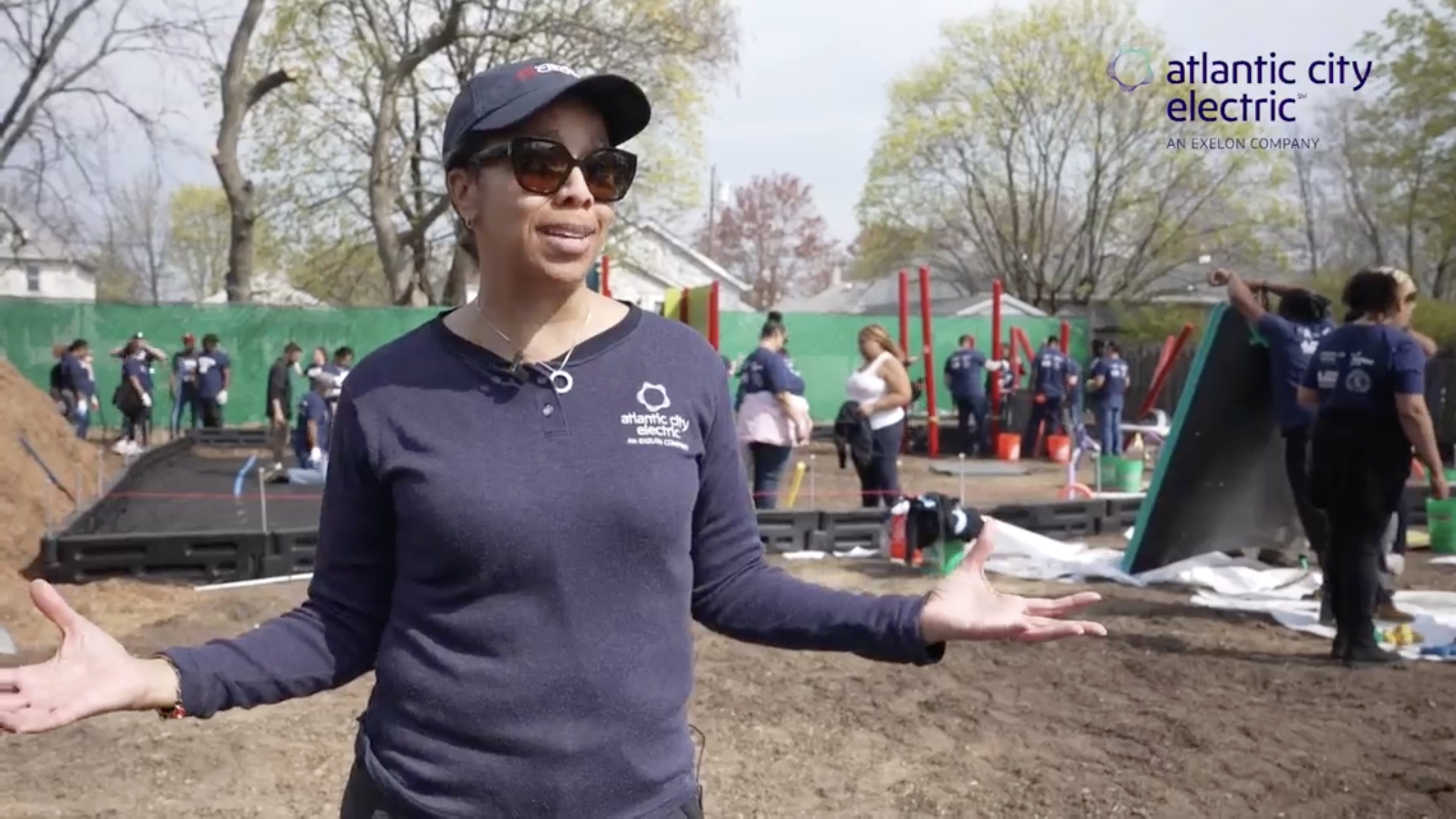 A person stood in front of a playground being built 