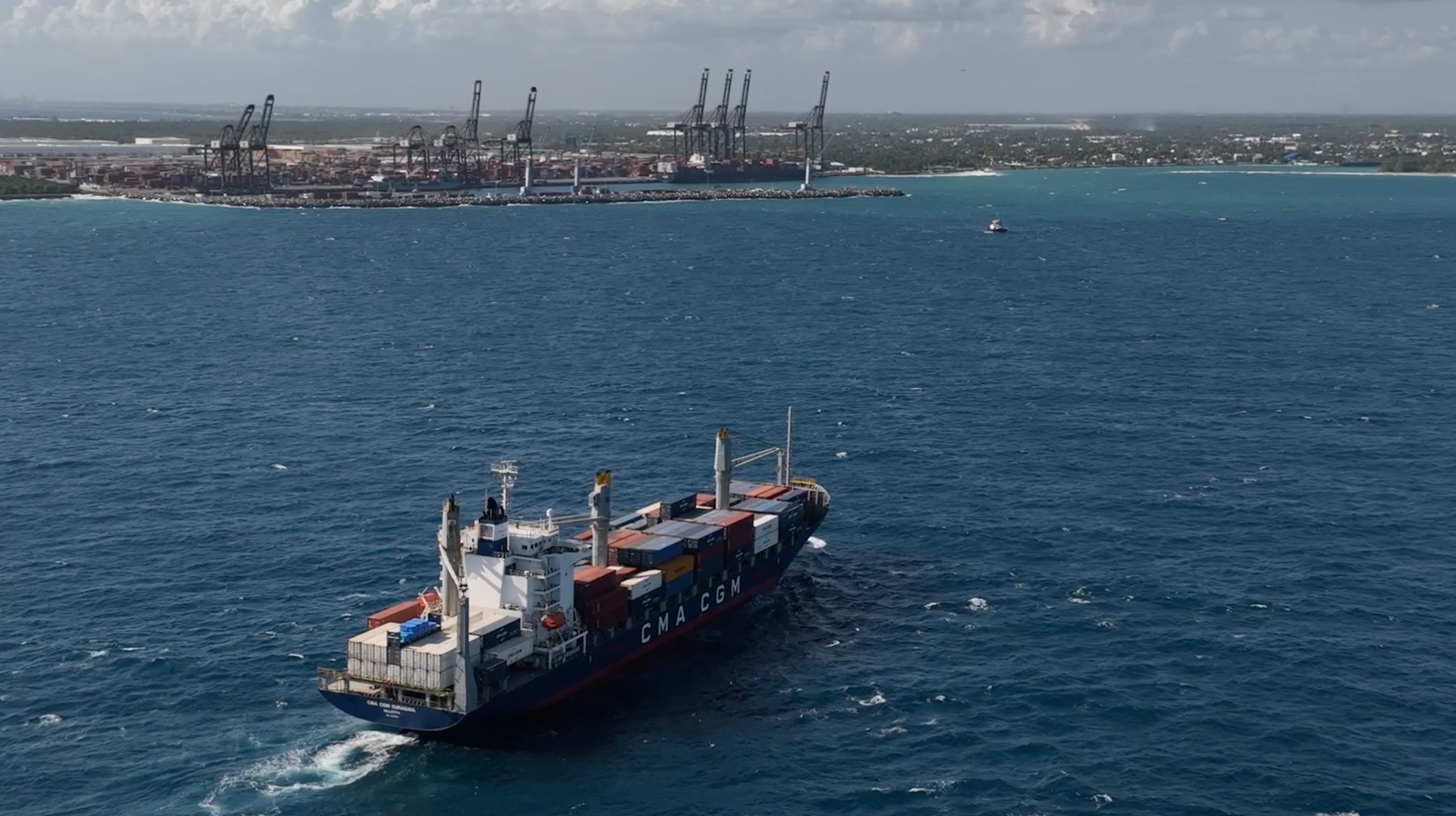 barge carrying shipping containers 
