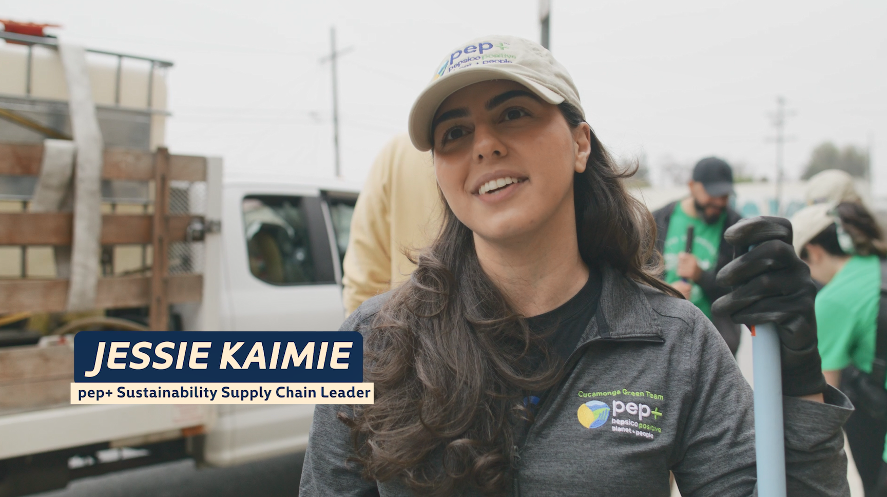 Jessie Kaimie and title. Others behind them with shovels.