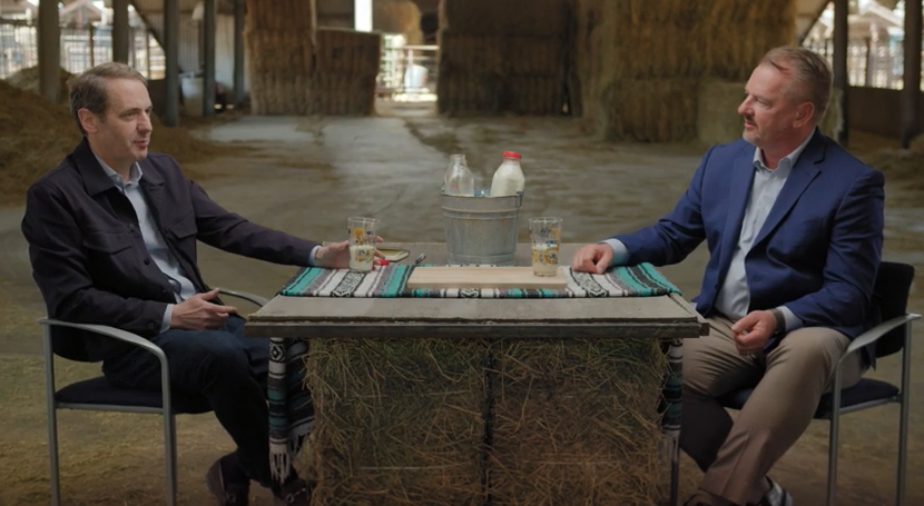 two men sitting at a table 