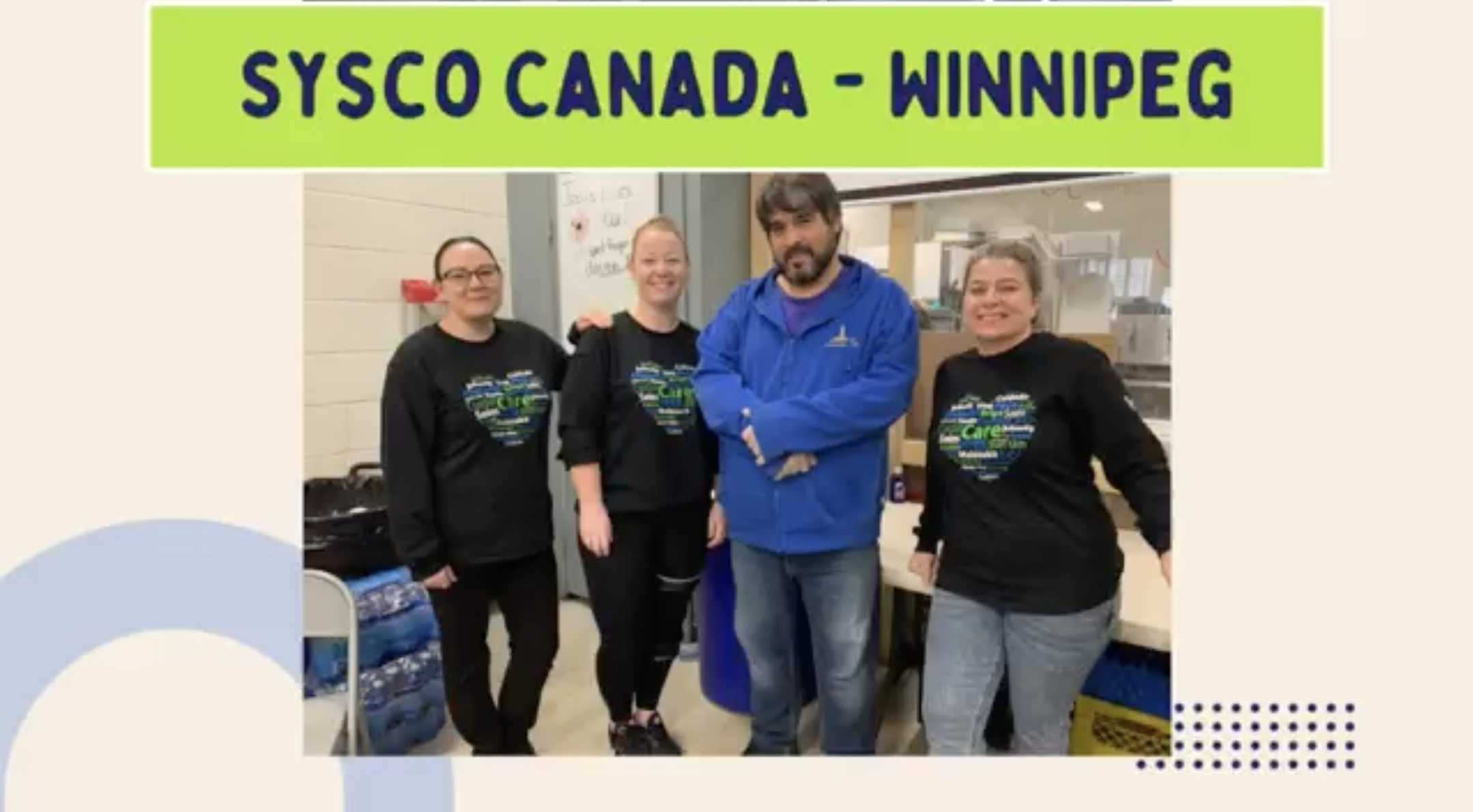 Four people stood together for a photo 