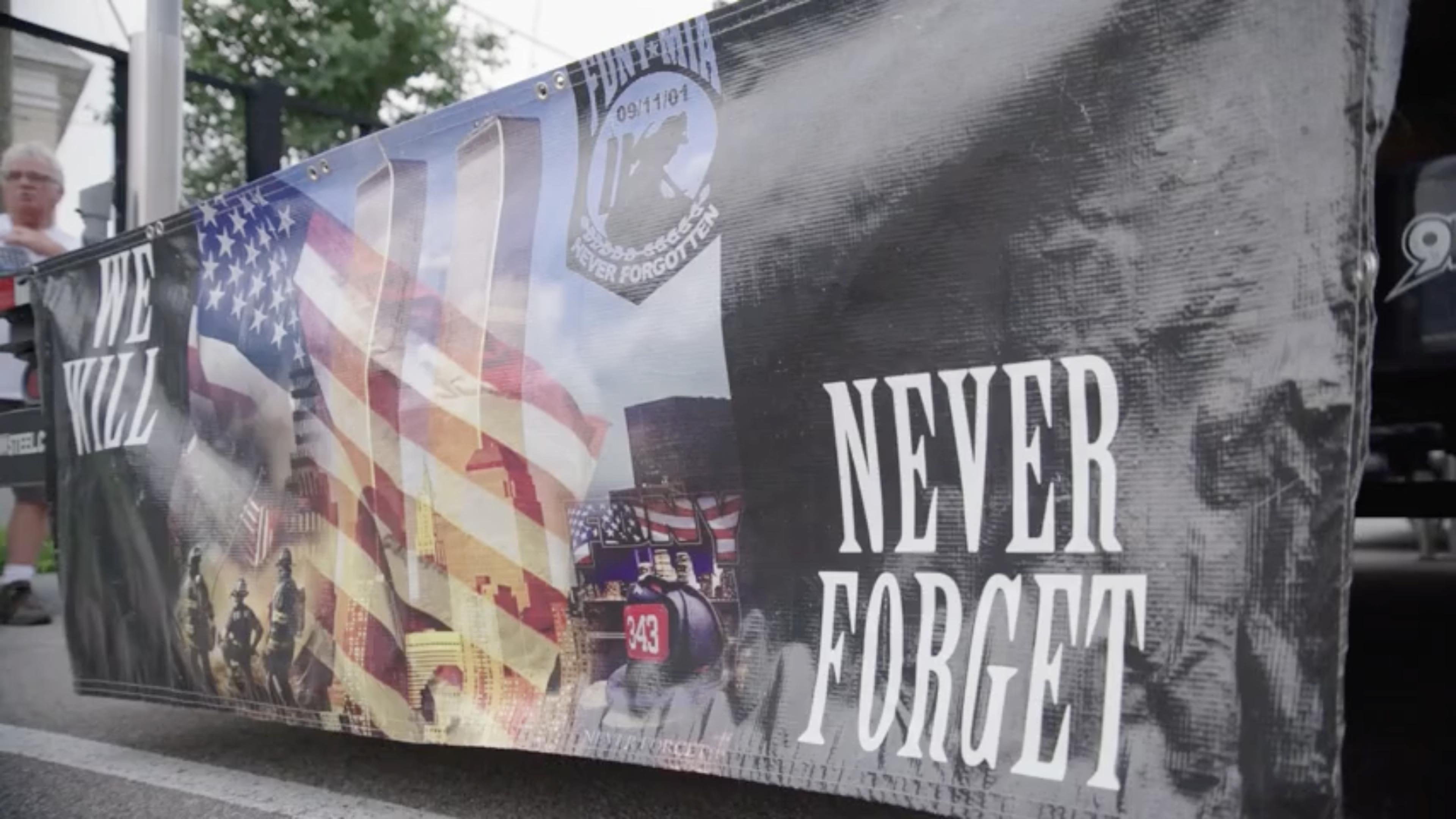 A banner with the text "never forget" 