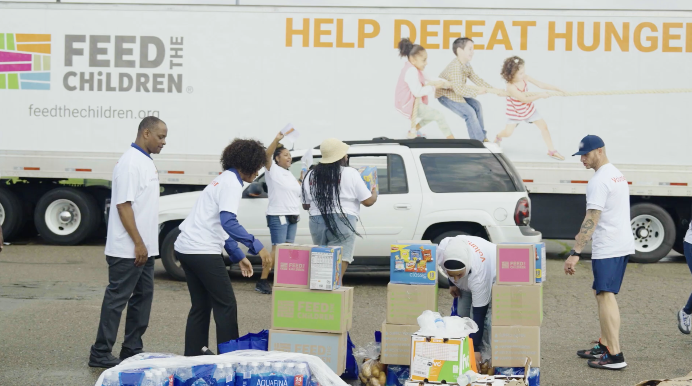 Volunteers stack boxes