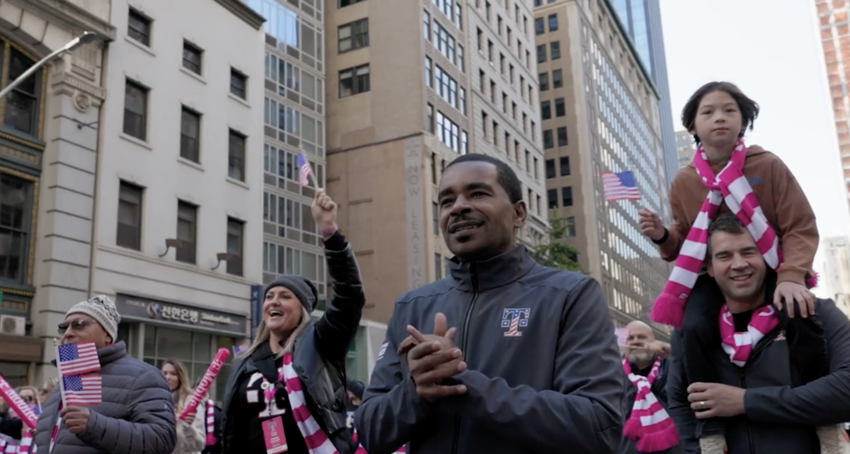 A crowd marching through the street showing their support