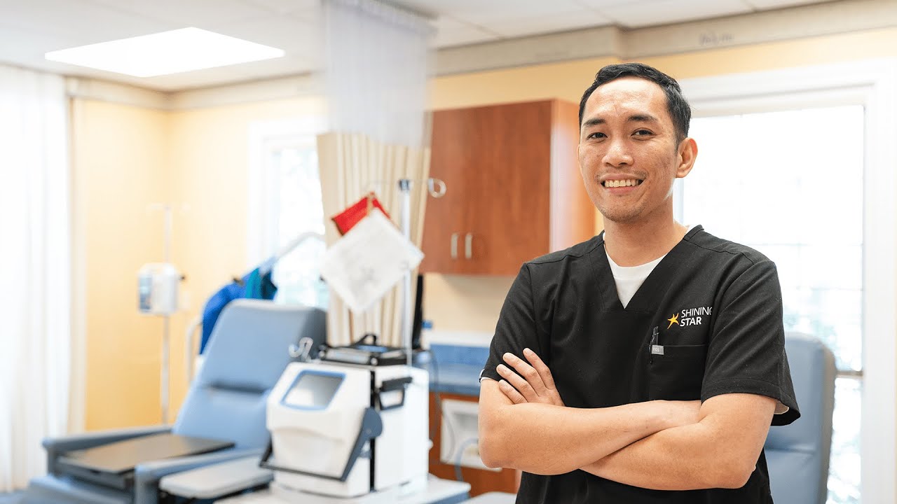 A person in scrubs in a health care setting