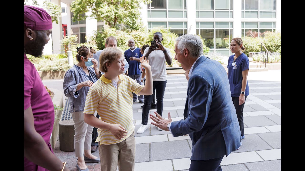 Justin high-fiving someone