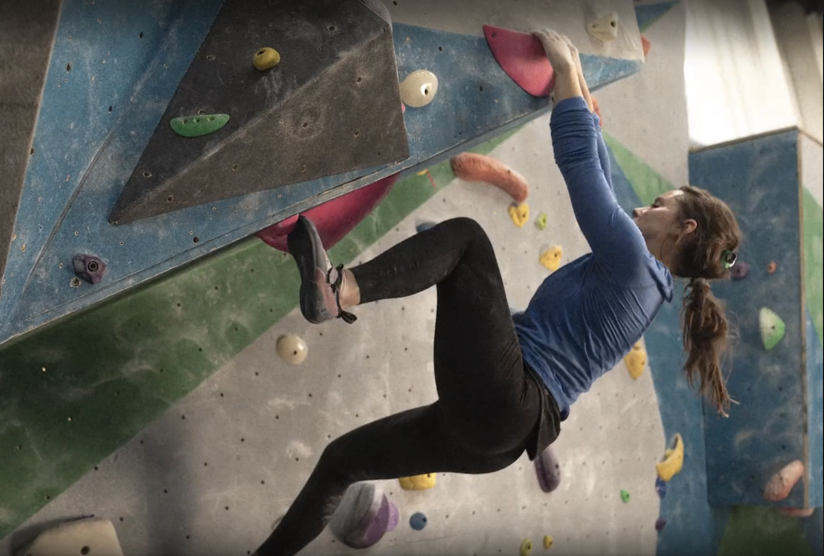 Alexandra Toth climbing a rock wall