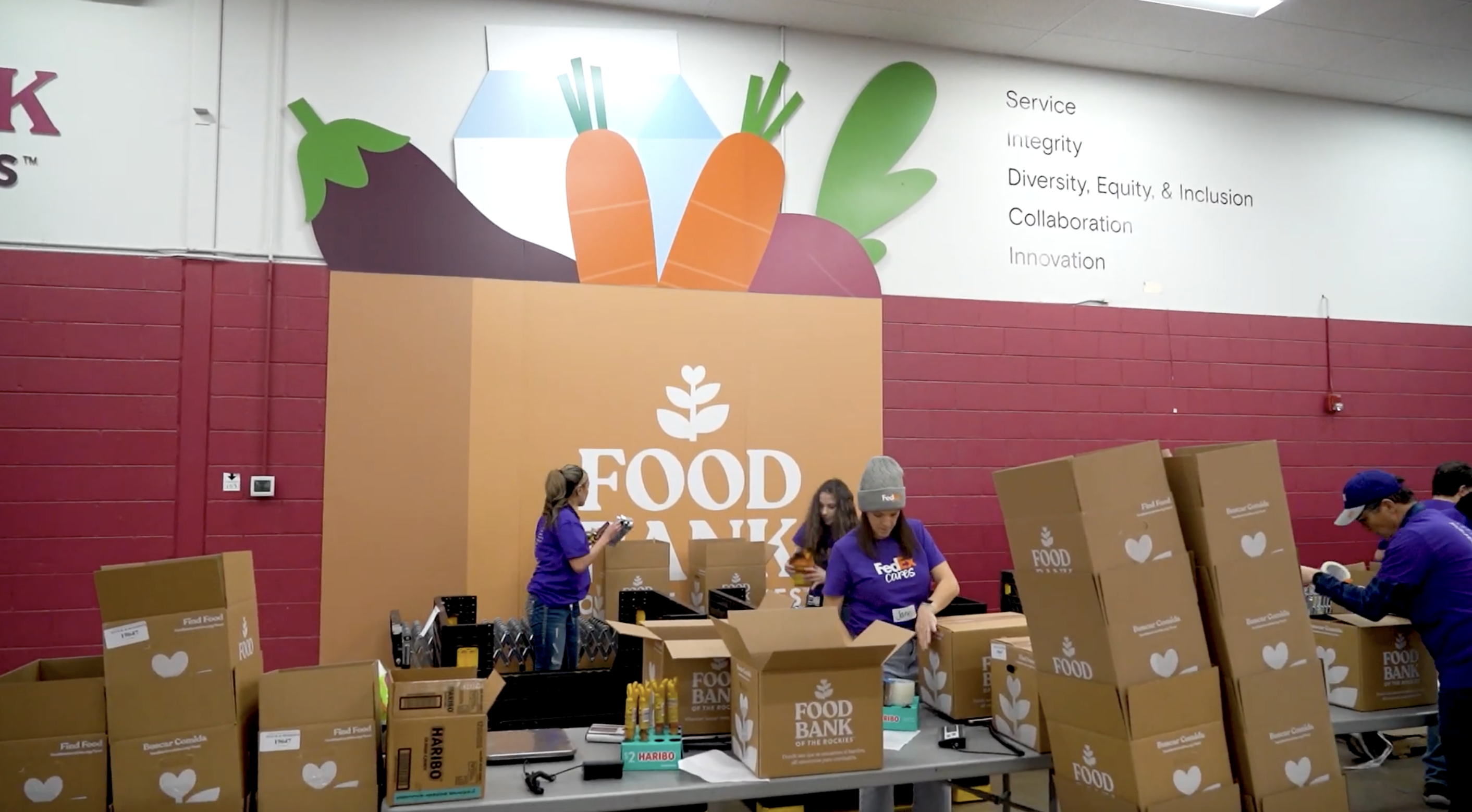 Volunteers packing up boxes at the Food Bank