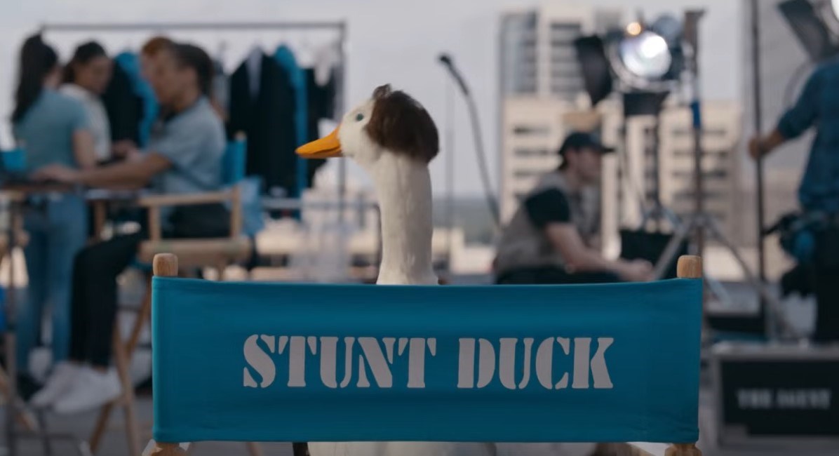 Aflac Stunt Duck shown in a directors chair.