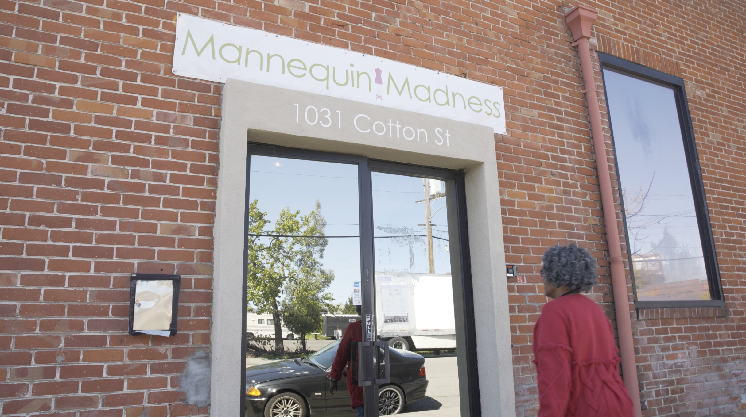 Person walking into Mannequin Madness