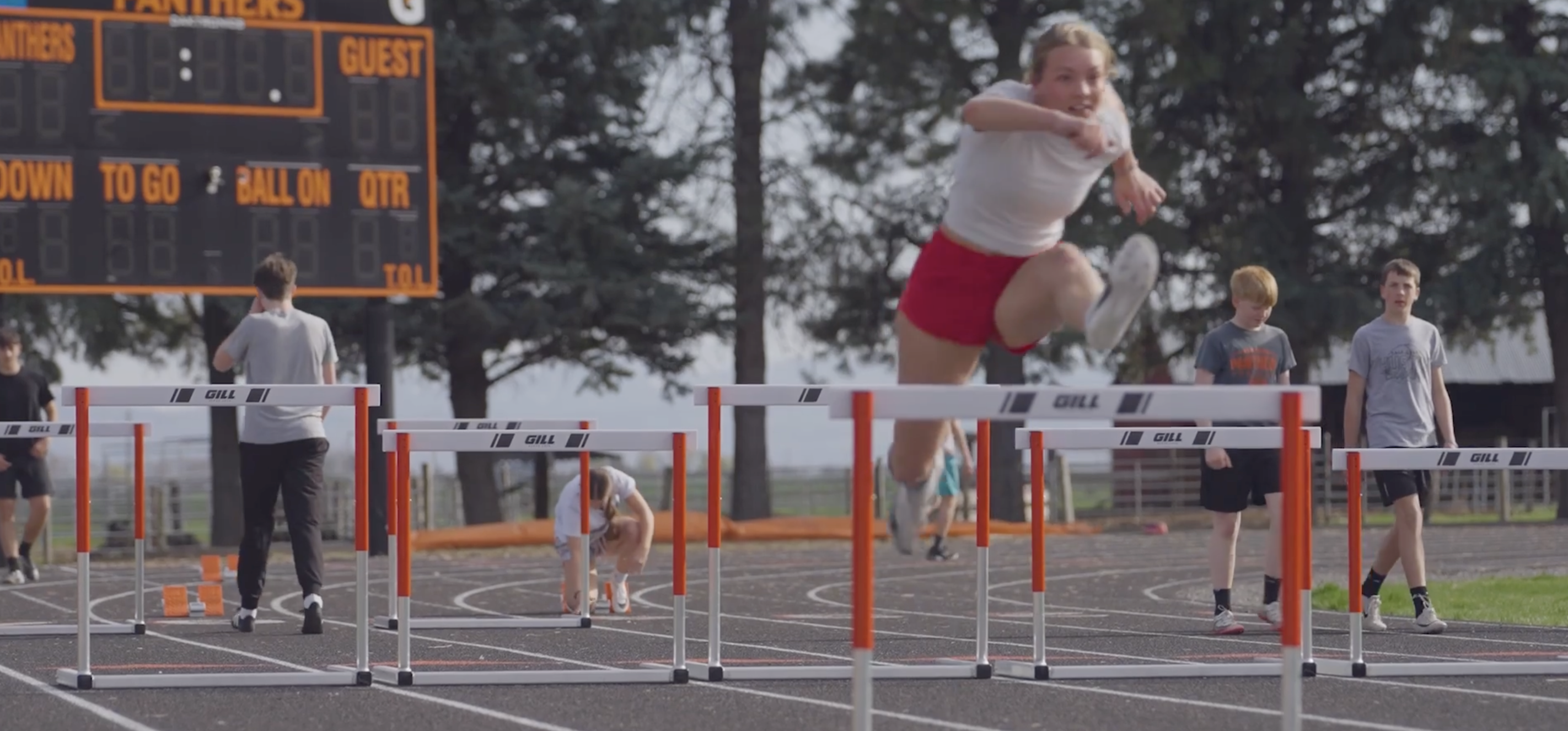 athlete jumping a hurdle