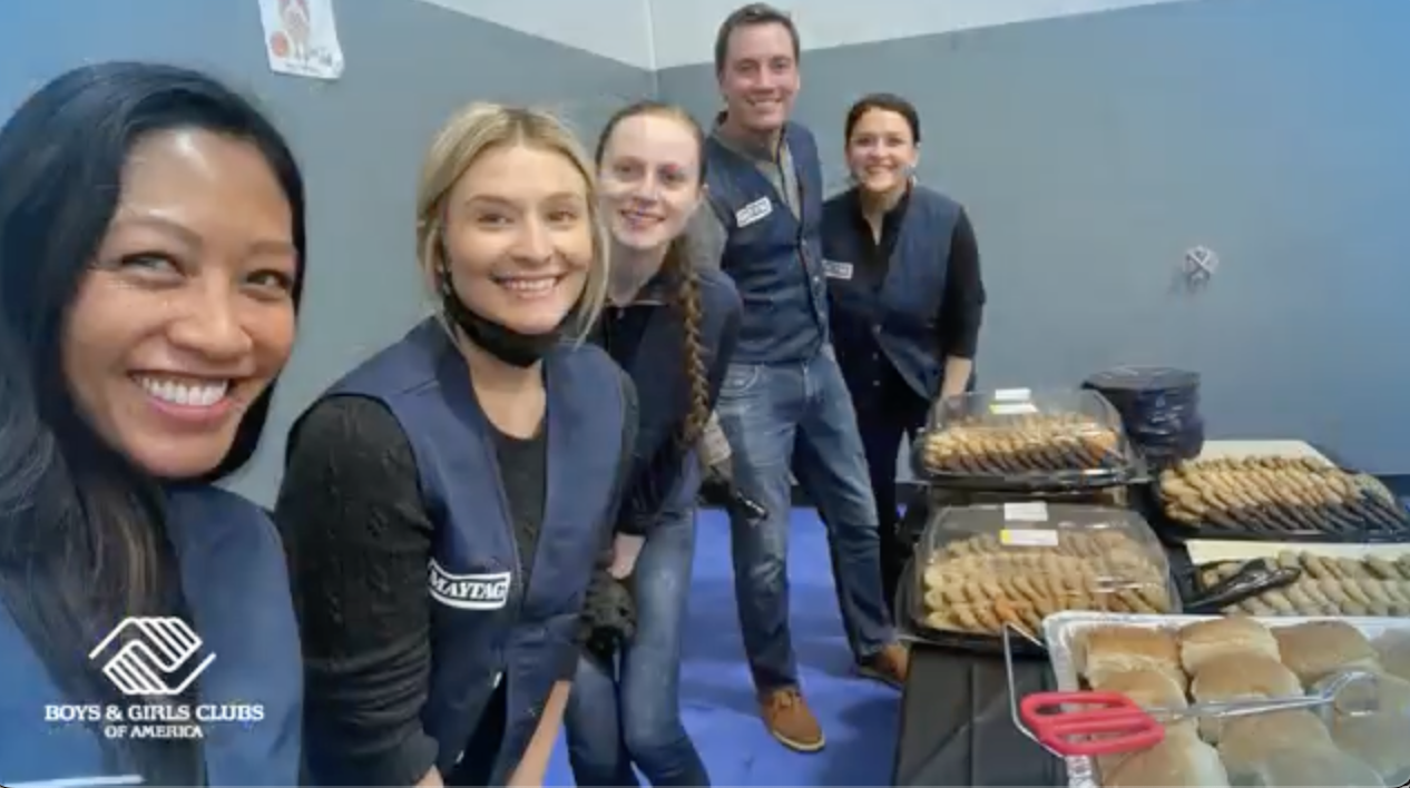 volunteers at tables of food