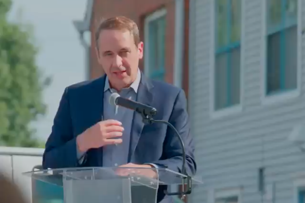 A person speaking at a podium