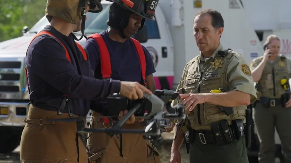 Rescue workers handling drones