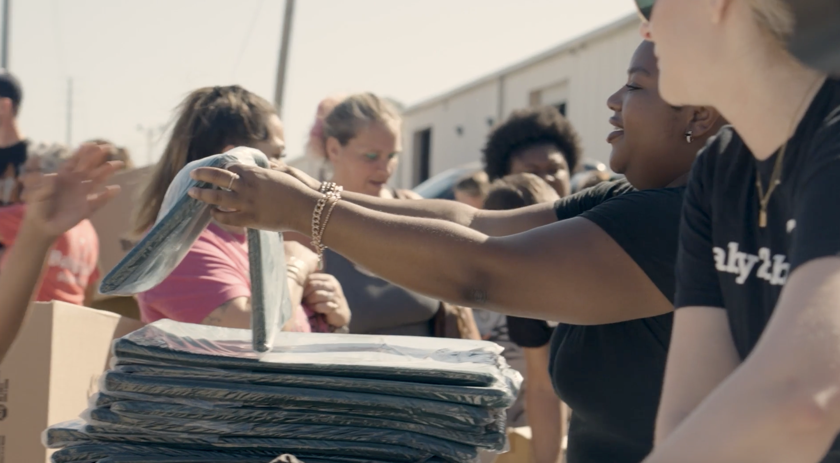 Volunteers handing out packages
