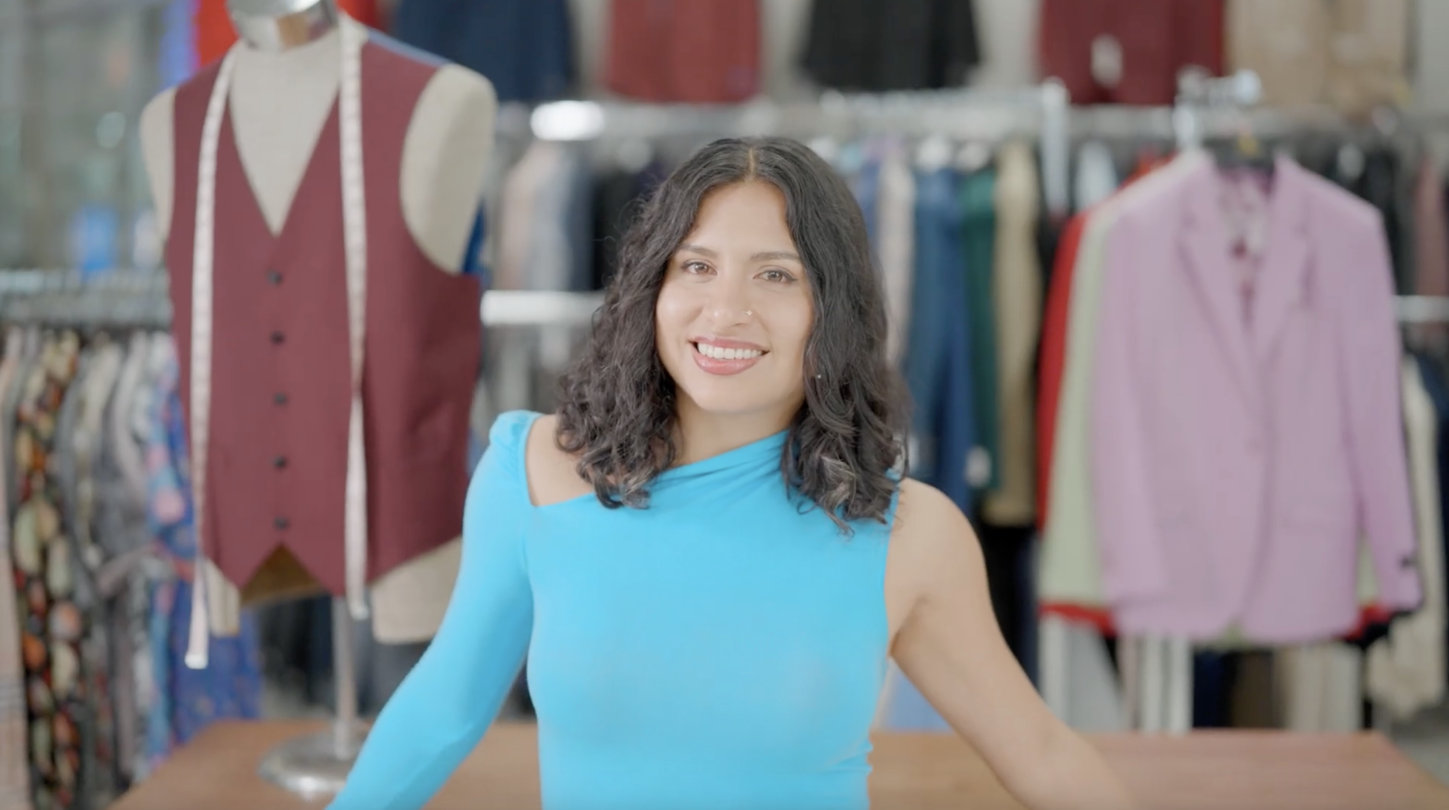 Naomi Romo in her family’s Miami clothing store, Anghelo’s Suit & Tux. Photo credit: Maggie M. Bailey