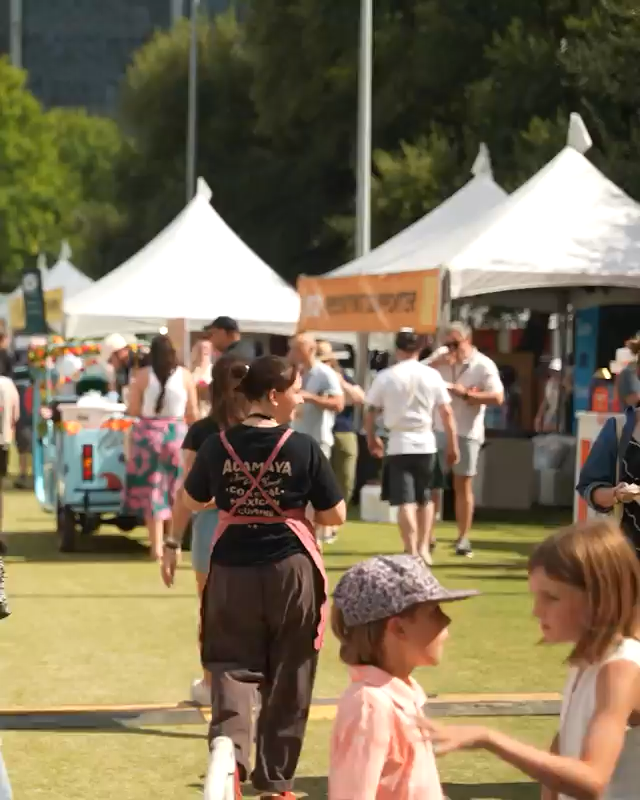Food trucks and people at a fair