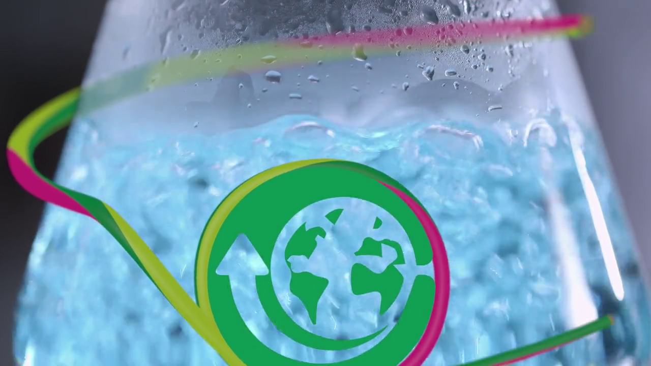 Image of a science beaker with bubbling liquid and a green graphic resembling the earth.