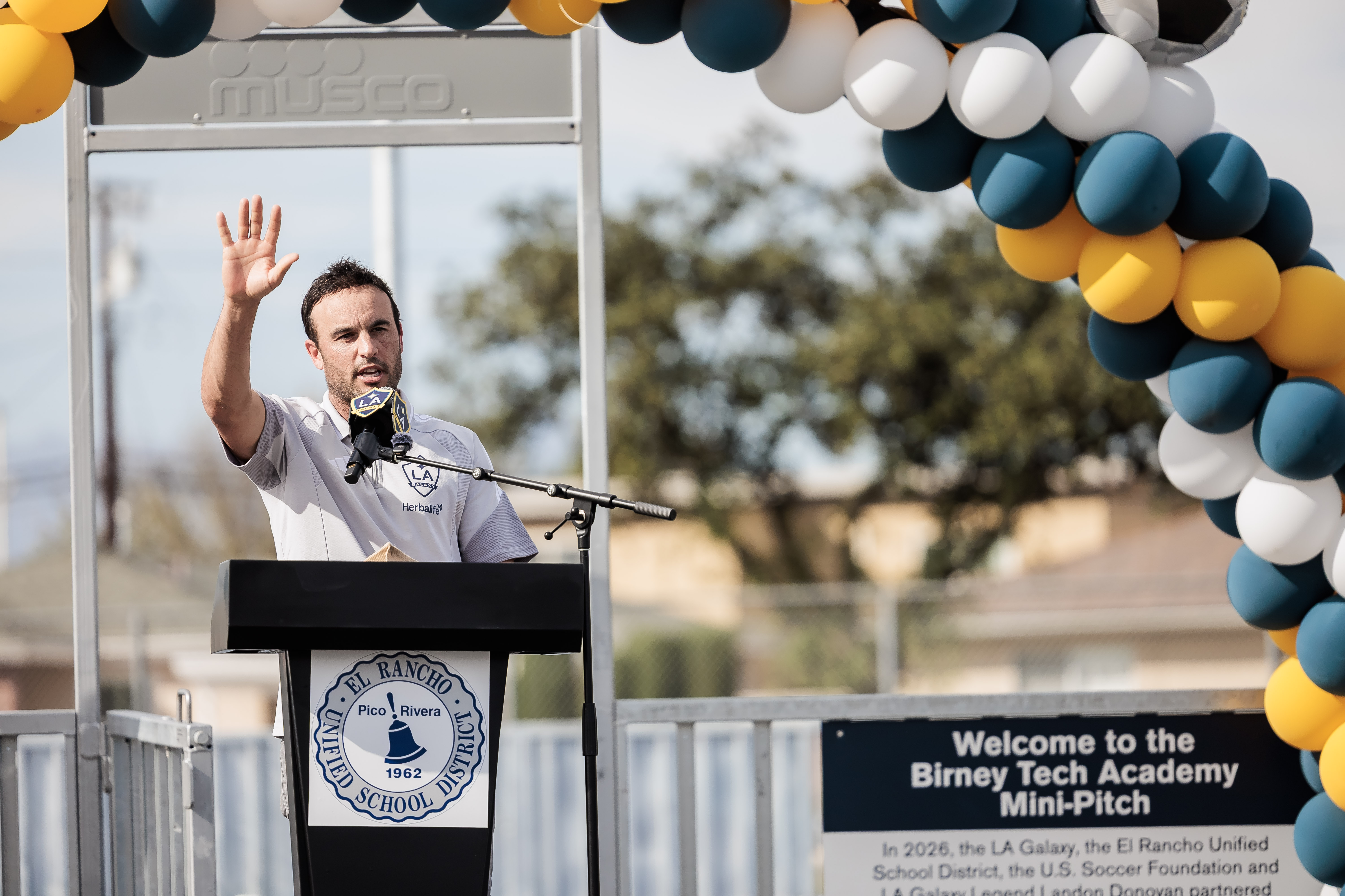 Landon Donovan speaking at podium