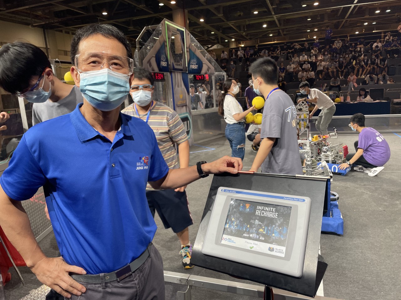 Rockwell’s Zhongjie Li serving as a judge at a FIRST® Robotics Competition in Hangzhou, China.   