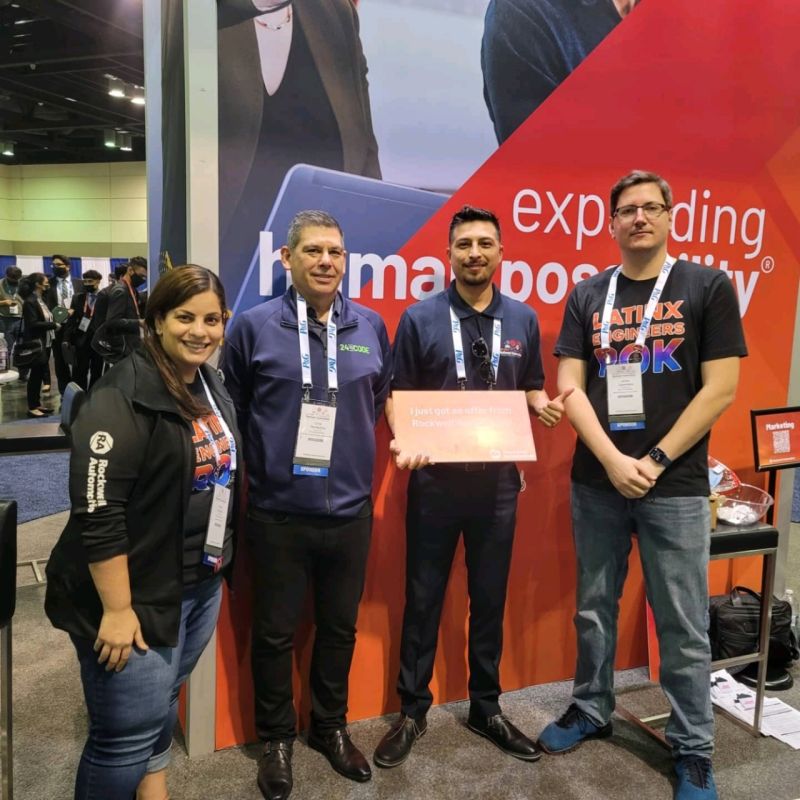 SHPE attendee Alexandro Castaneda (second from right) celebrates his offer with Rockwell’s (from l to r) Sabha Museteif, Chris Nardeccia, and James Cayemberg.