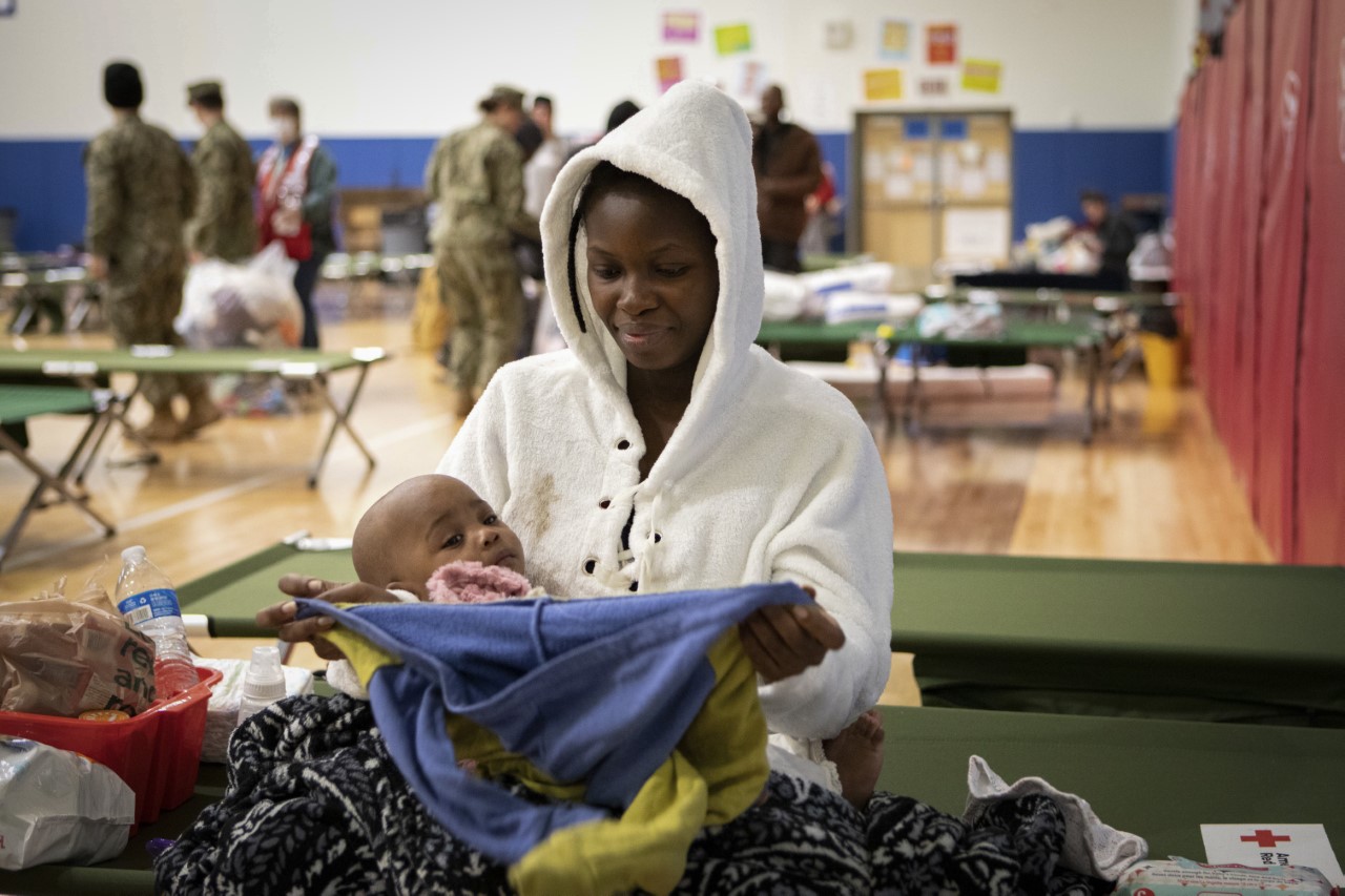 A mother and baby at a Red Cross shelter