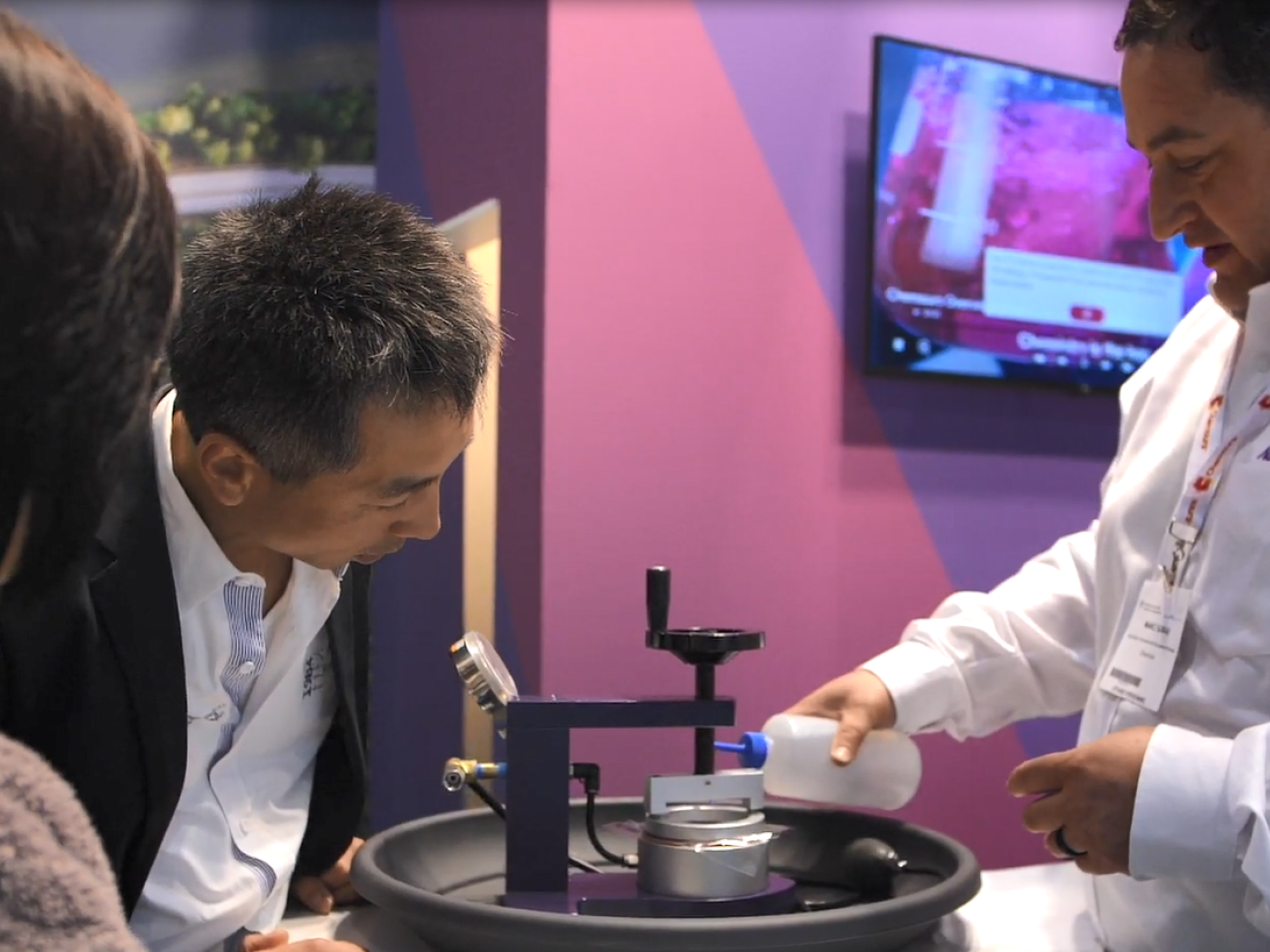 A Chemours employee demonstrating Nafion at a convention.