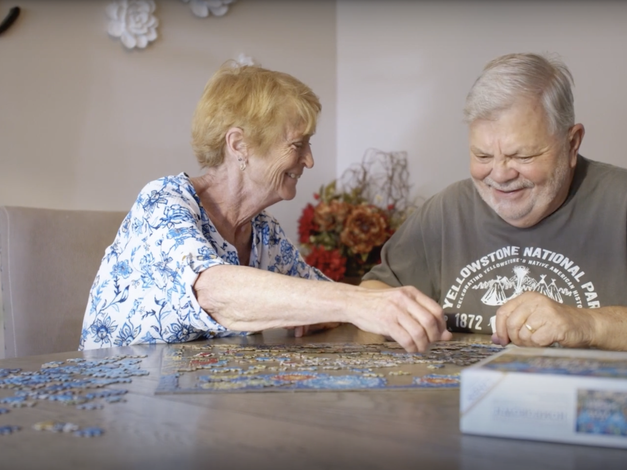 Marion and her husband working on a jigsaw puzzle together
