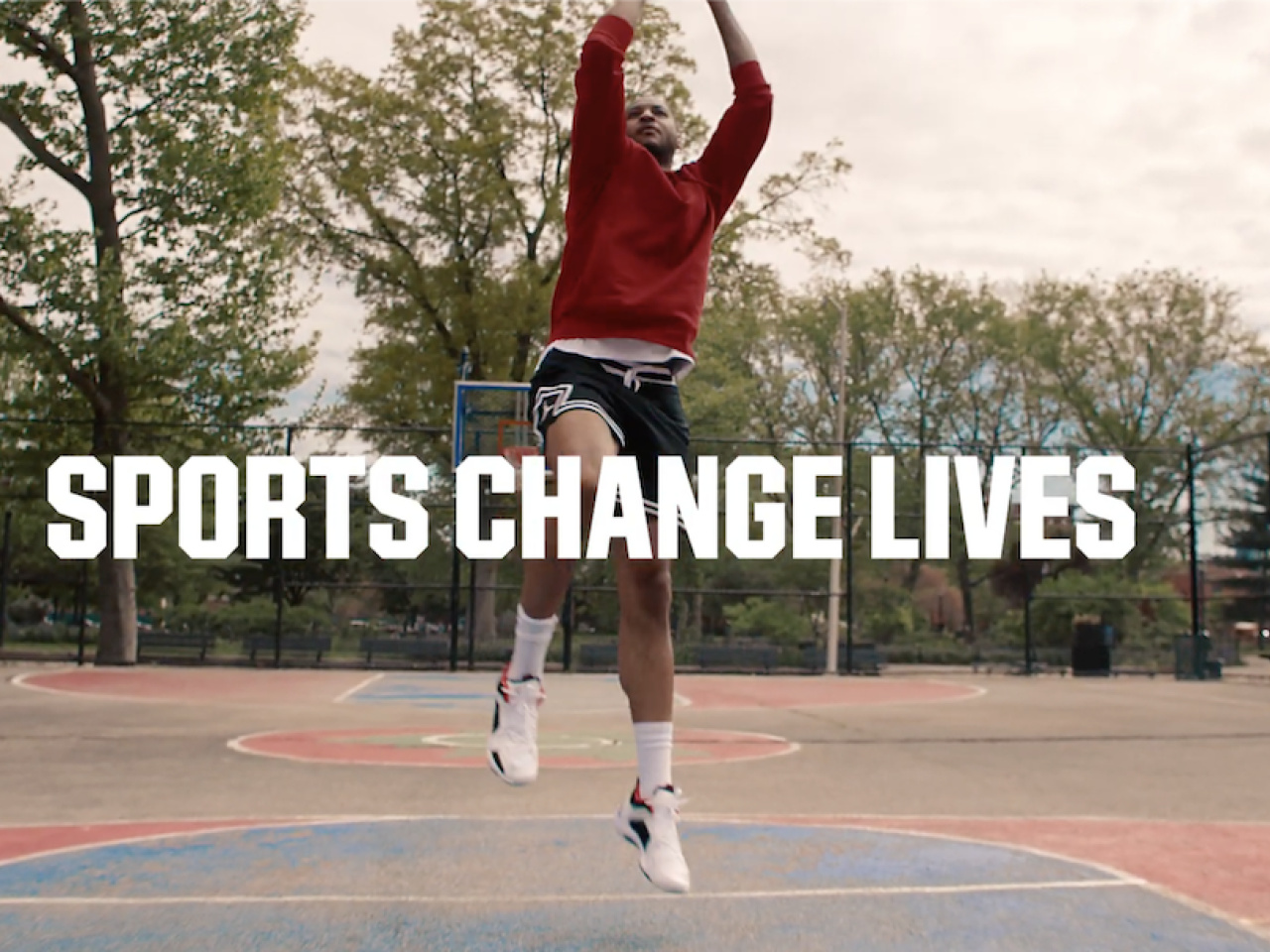 Sports Change Lives; Carmelo Anthony shooting a basketball.