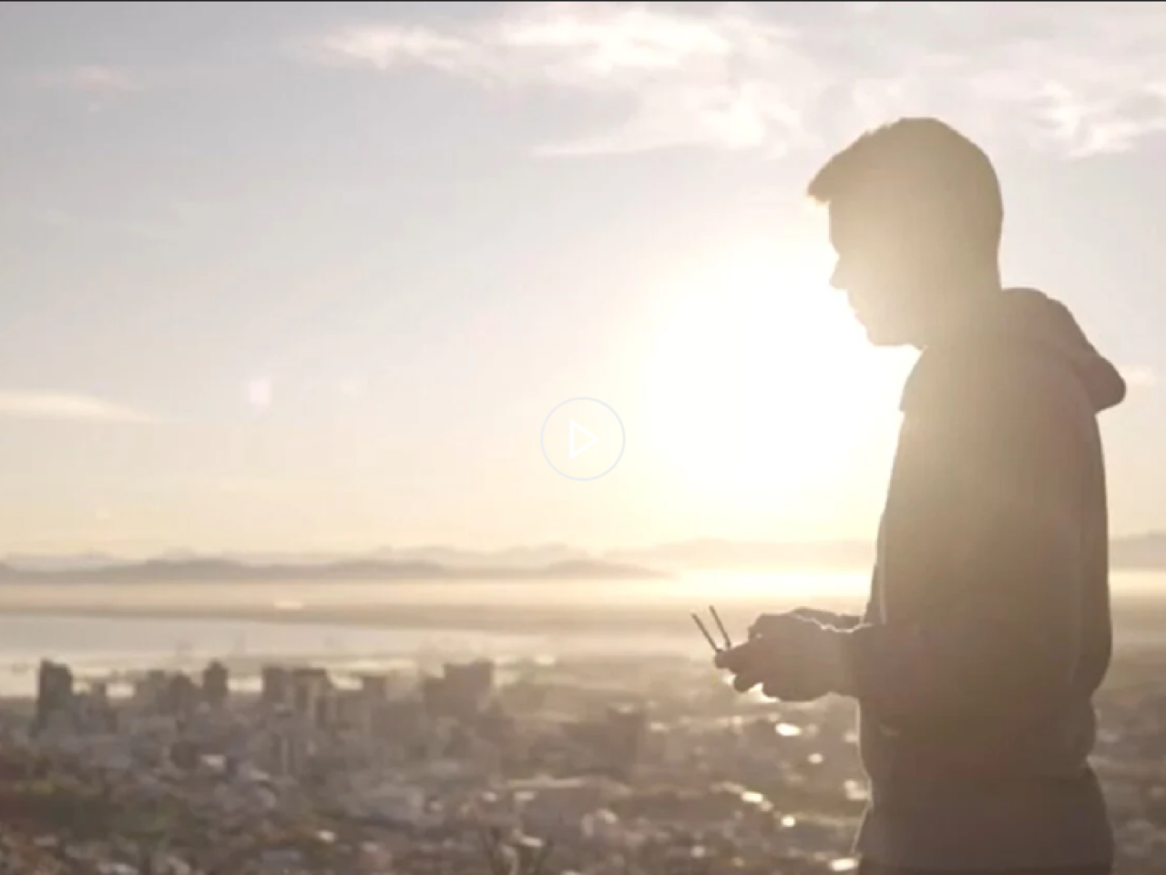 A person flying a drone