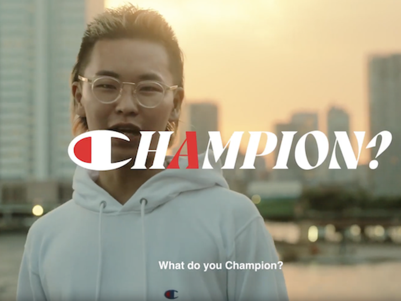 Champion: What do you champion. Photo of a young designer in front of a city scape.